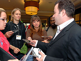 Film & TV Music Publisher Ted Lowe, networking with TAXI members outside the Road Rally ballroom.