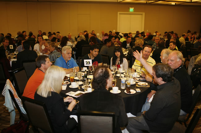 A-List Hollywood Performance Coach, Steven Memel (foreground, with hand raised) gives some advice during the Mentor Lunch at TAXI's Road Rally.