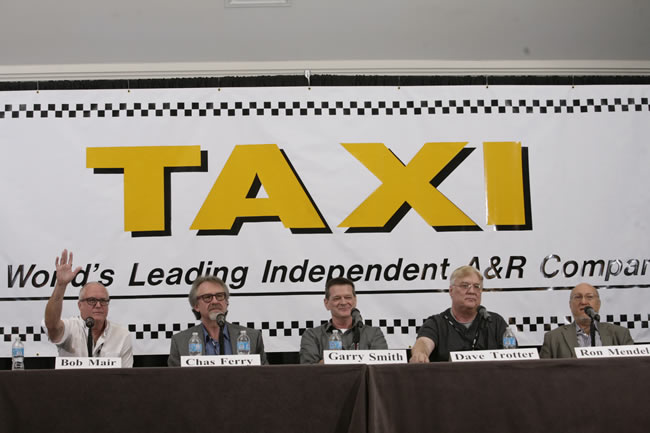 Music Library Executives Bob Mair, Chas Ferry, Garry Smith, Dave Trotter, and Ron Mendelsohn listen to TAXI member's music during their panel at Road Rally 2013. Bob Mair raises his hand and says, 'I'd like to get a copy of that song!'
