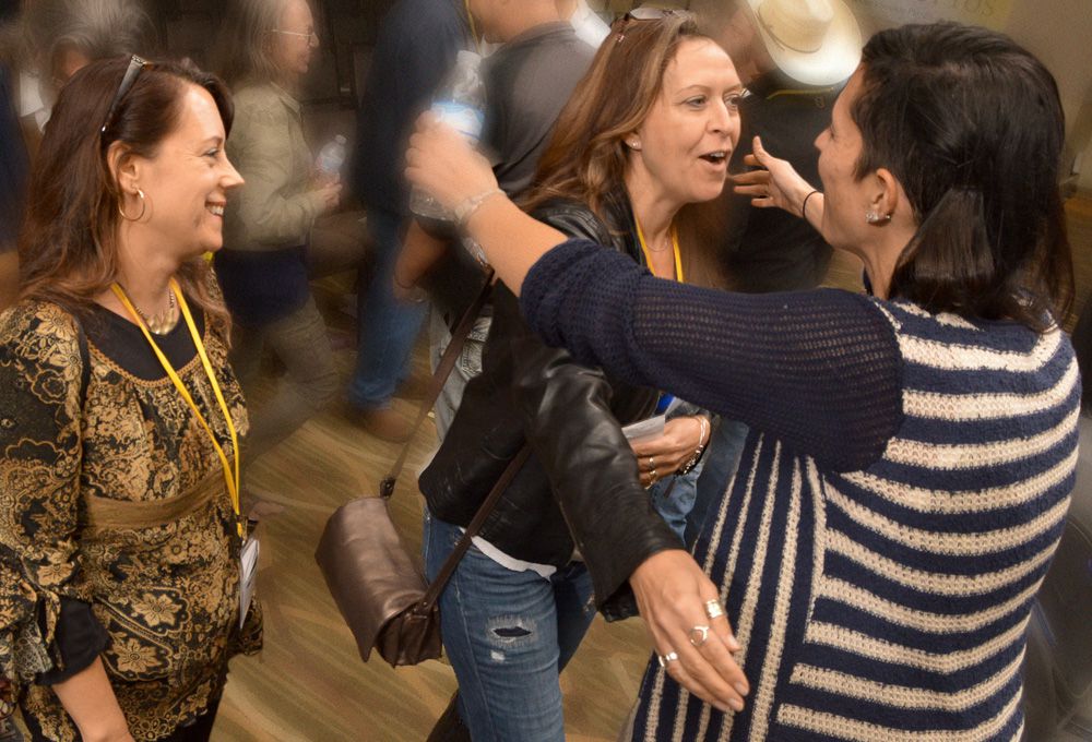 People love how TAXI’s Road Rally brings the industry together with songwriters, artists, and composers. Our photographer captured member Spring Lovelle looking on as TAXI member Michelle Lockey is about to get a big hug from Match Maker Music’s CEO, Brooke Ferri (right)