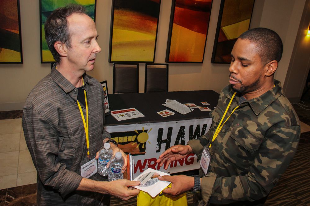 (left to right) Music Supervisor Jonathan Weiss takes a few minutes to hang out with and get some new music from TAXI Member Terrell Burt at the Road Rally.