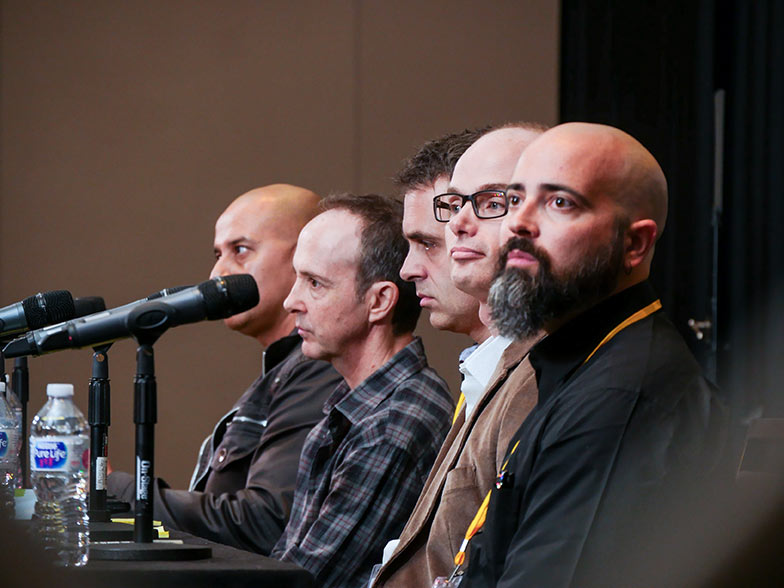 Joy Basu, Jonathan Weiss, Michael Kruk, Pedro Costa, and Timothy Hogarth are all paying close attention to an instrumental track played during the Instrumental Pitch panel at the Road Rally.