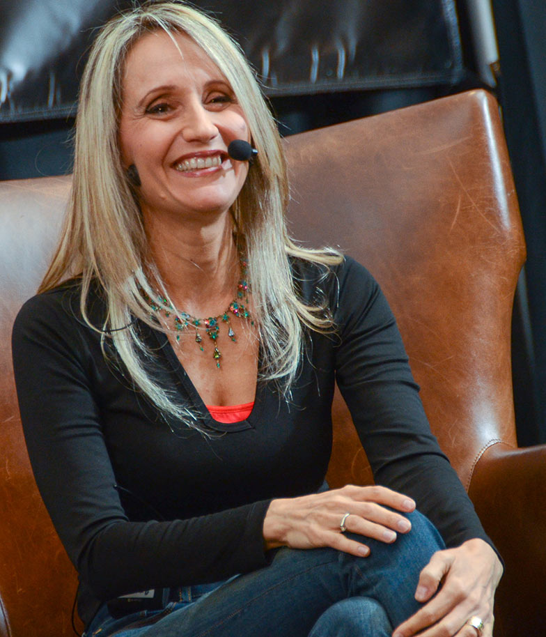 Hollywood film composer Sharon Farber is all smiles as she describes how she feels while conducting a full orchestra playing one of her compositions.