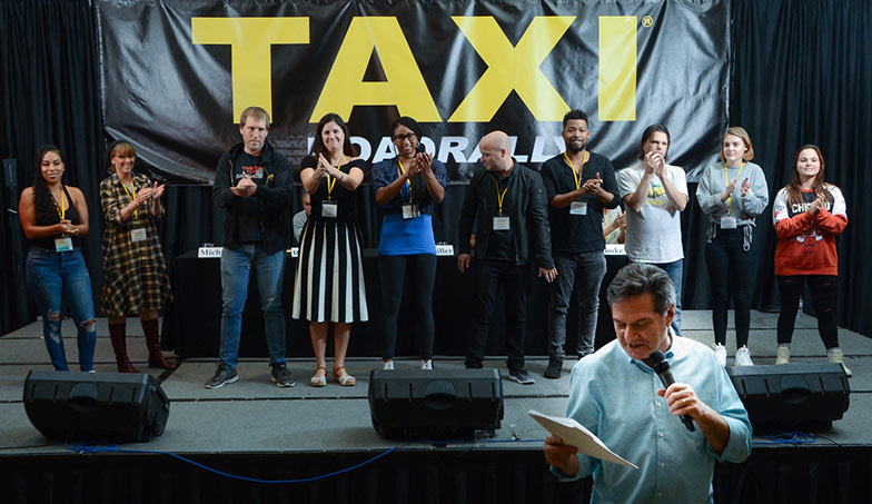 And the “boss” ends the Rally by thanking TAXI’s staff for all of their incredibly hard work and long hours that went into making the 2018 Road Rally the best one ever! From left to right, the TAXI staff members are: Angel Maradiaga, Debra Laskow, Matthew Hutchison, Laura Jackman, Enjelique White, Eric Anderson, Isaac Williams, Tom Stillwagon, Briagha McTavish, and Grace Wojick. 