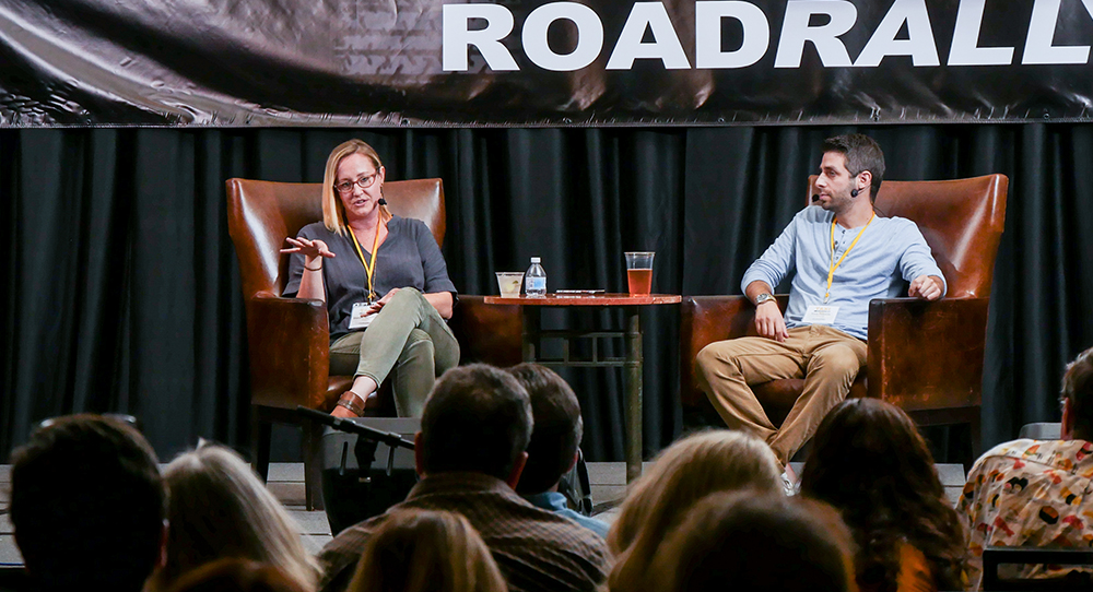 Shannon Quisenberry tells the audience, “I still always try to put my favorite song first on the list—the ones that I feel like fit better. But sometimes the eighth one gets picked,” as Frank Palazzolo listens intently to her answer.