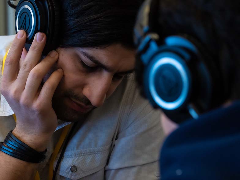Aram Mandossian is deep in thought as he listens to a TAXI member’s music during another one of the One-to-One Mentor Sessions.