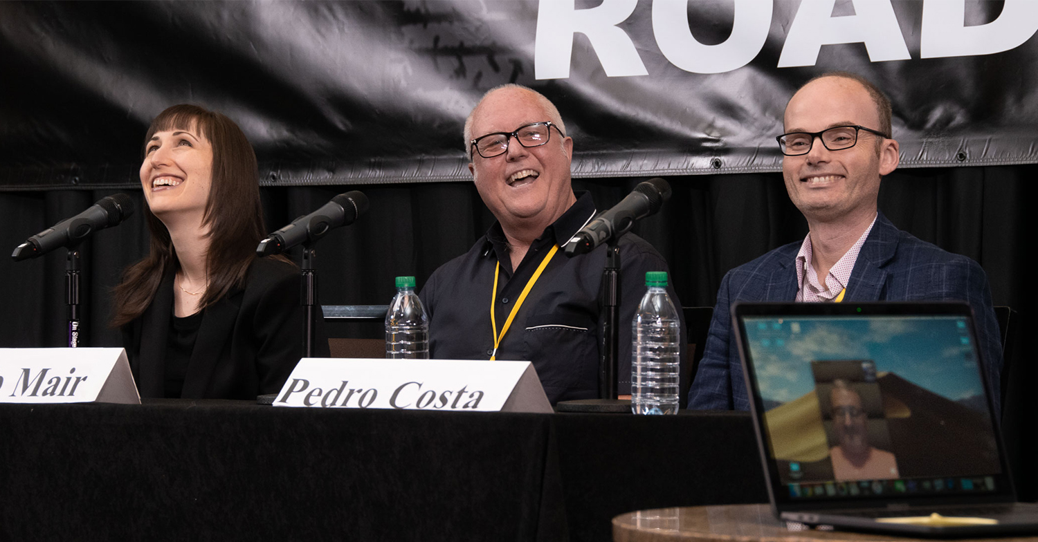 Panelists Erin Jacobson, Bob Mair, Pedro Costa and Michael Eames (seen on laptop screen) getting a little bit silly while discussing the serious topic of understanding music library contracts at TAXI's Road Rally 2019!