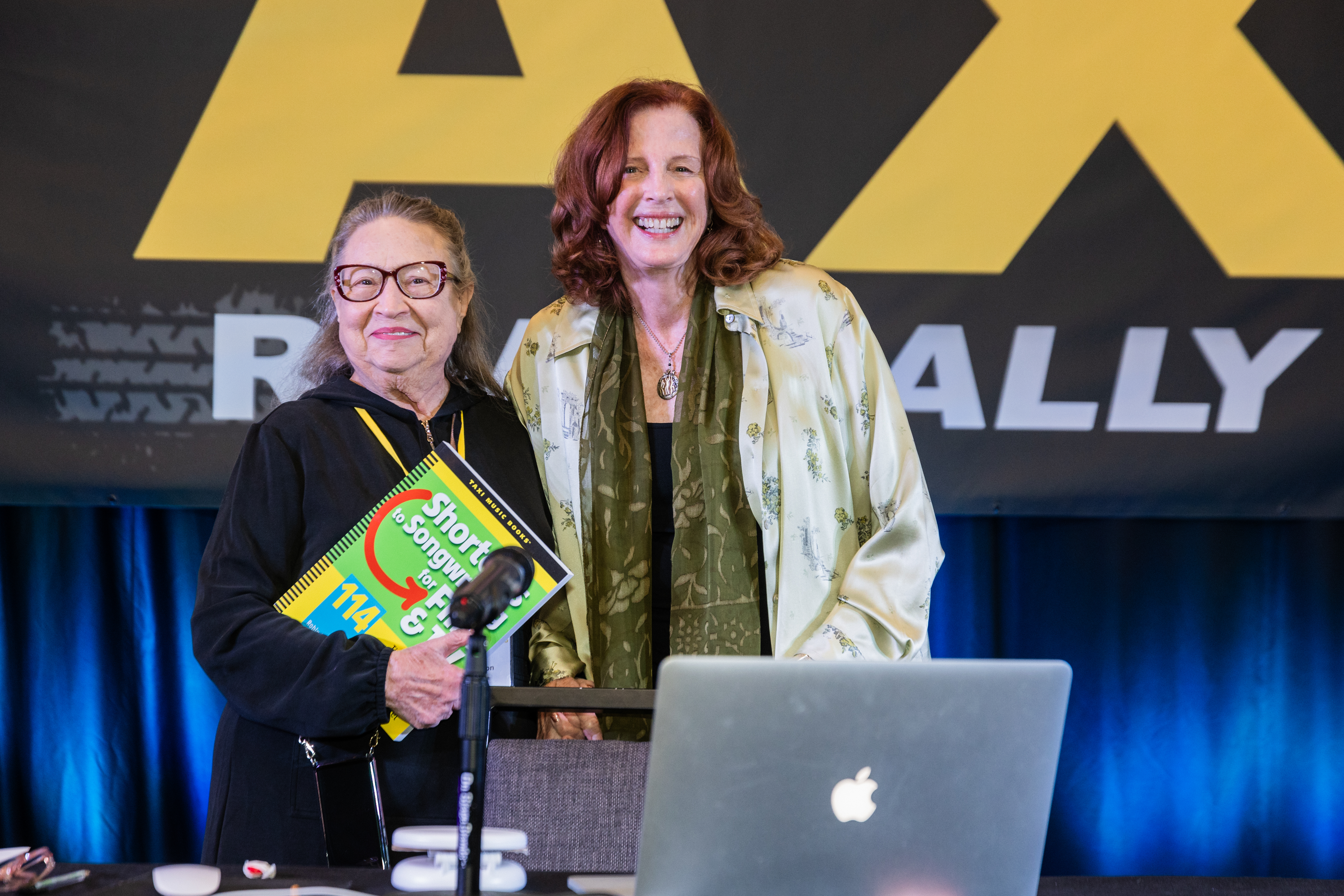 TAXI member Betty Anderson was all smiles when she won a copy of Shortcuts to Hit Songwriting by Author and Songwriting coach Robin Frederick, who packed the ballroom as always. Robin never disappoints!