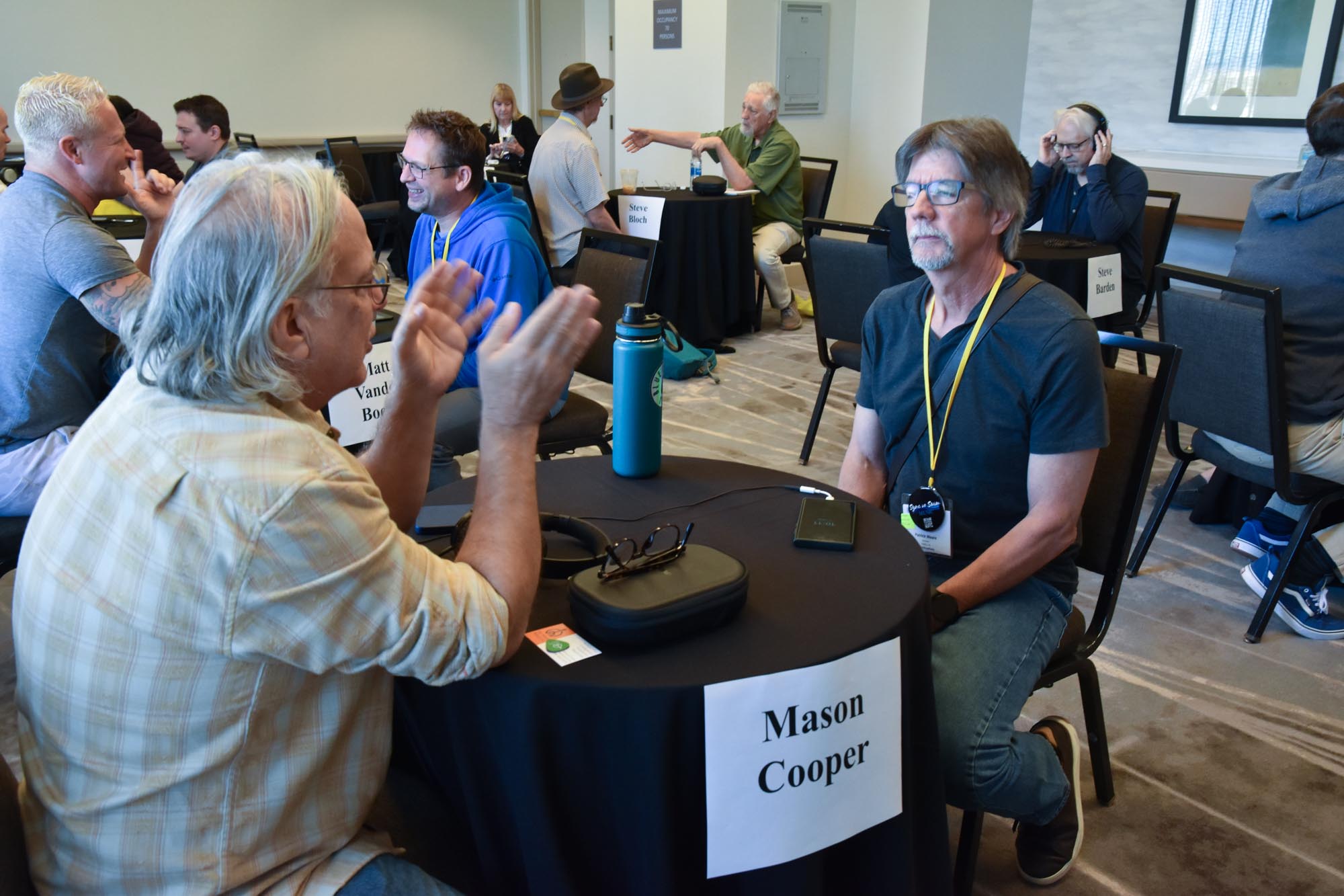 Music Supervisor Mason Cooper (l) giving expert feedback to TAXI member Pat Waara.