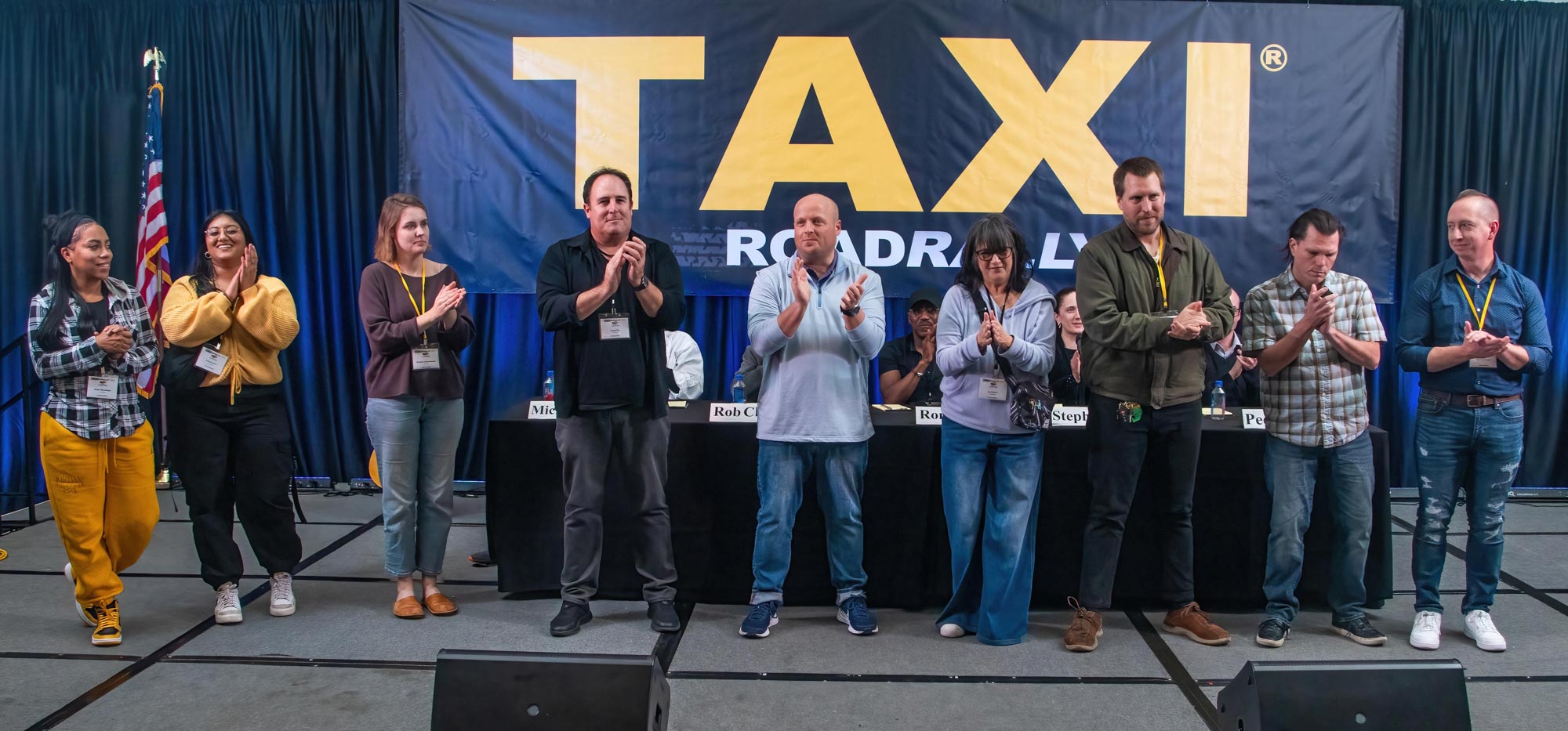 Meet the incredible TAXI staff who take great care of our members year-round and do an extraordinary job during the Road Rally. Here, they’re receiving a standing ovation at the end of the weekend. They are (l to r): Angel Maradiaga, Ashmita Deo, Briagha Abrahamson, Craig Pilo, Eric Anderson, Liz Cohen, Matthew Hutchison, Tom Stillwagon, and Andrew Jordan.