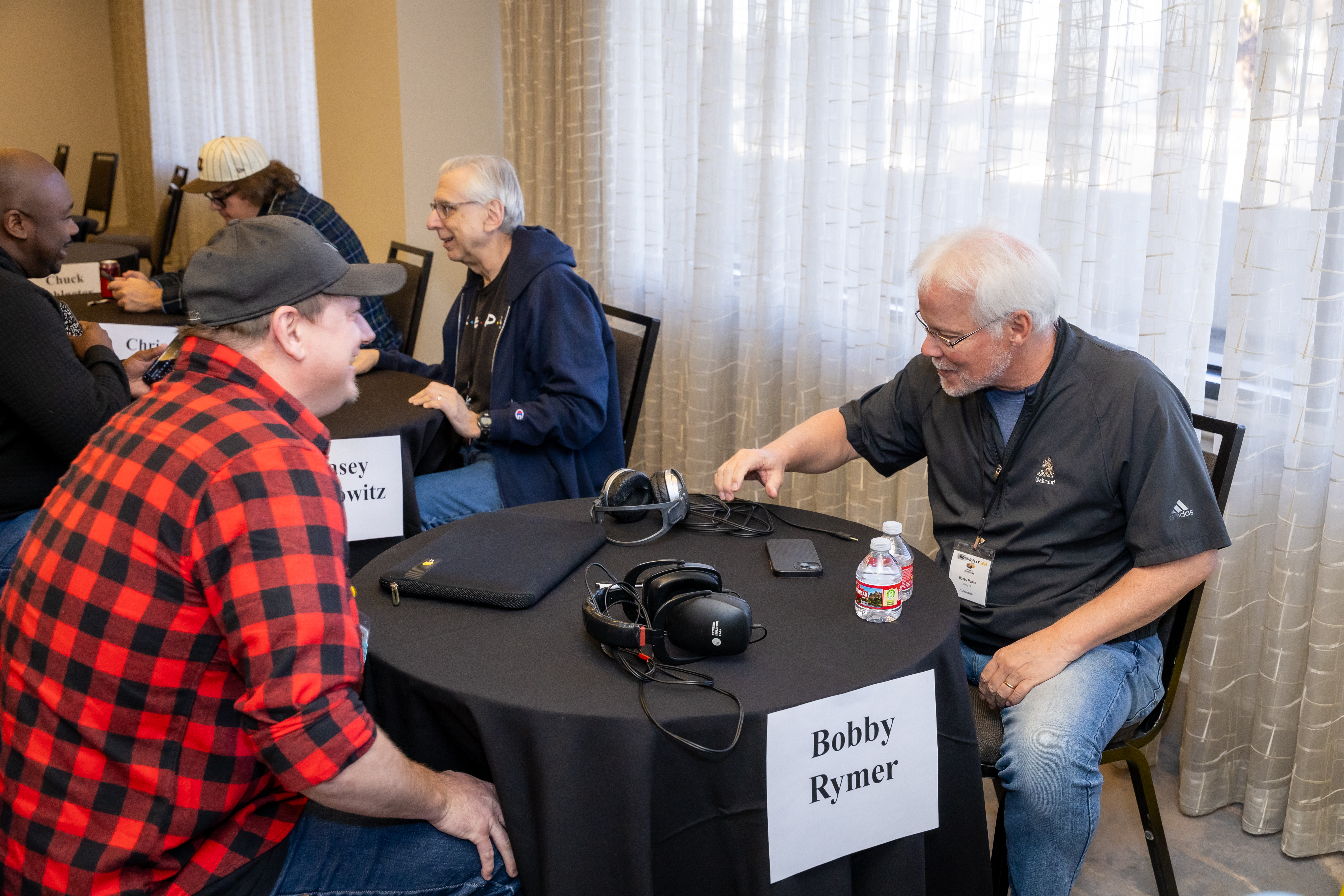 Music Row publisher Bobby Rymer undoubtedly giving some great feedback to a TAXI member during the One-to-One Mentor Sessions.