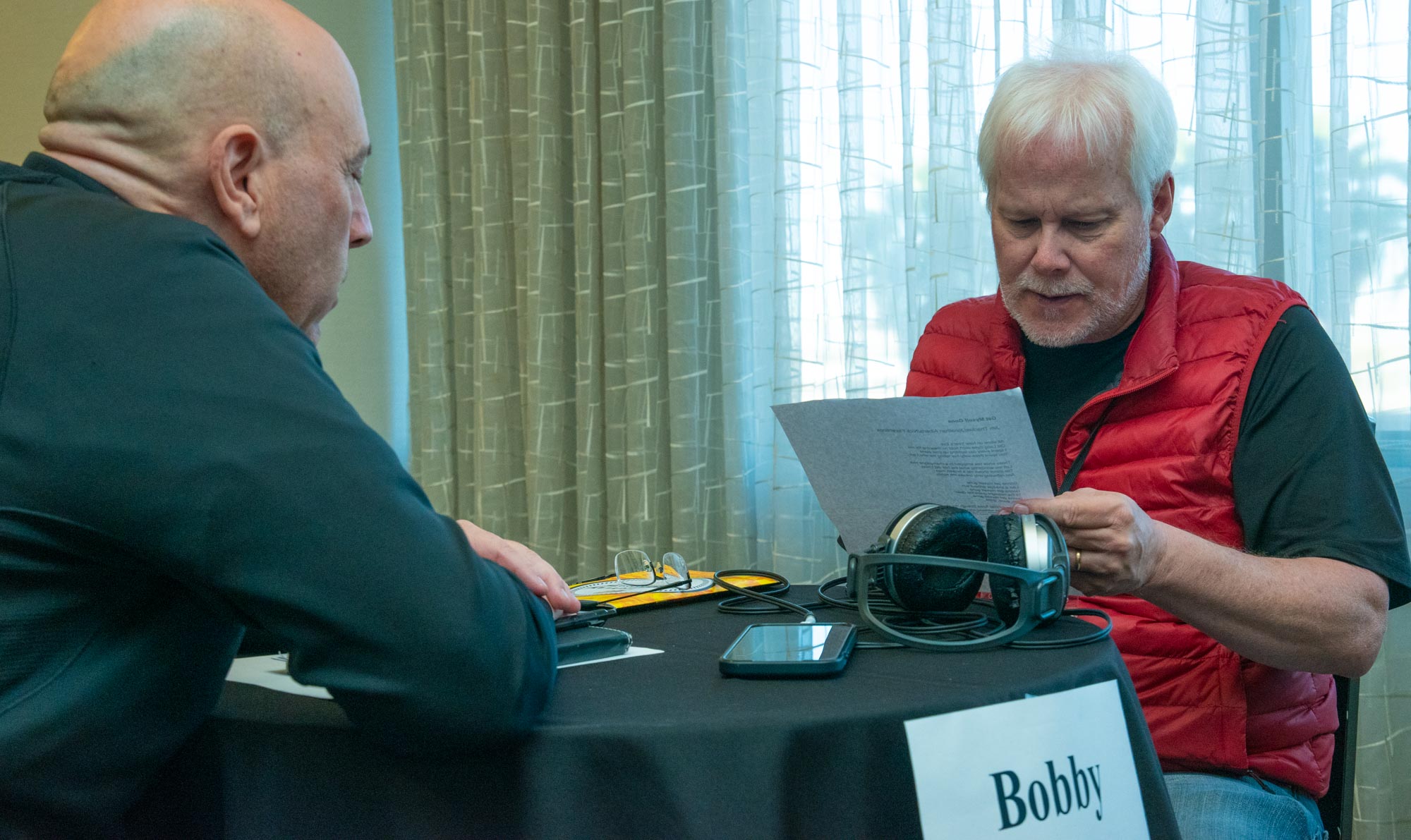 Country music publisher Bobby Rymer carefully considers a lyric before dishing up some great advice to a TAXI member during a One-to-One mentor session. These are free at the Road Rally!<