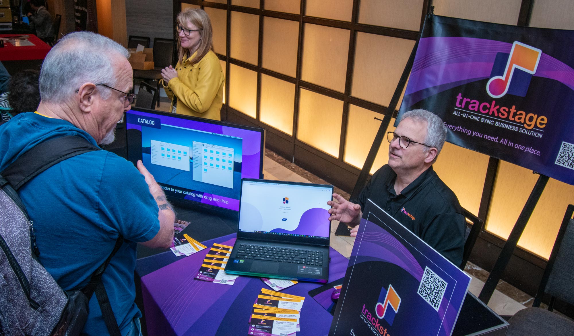 Scott Barker fills a booth visitor in on how Trackstage can help organize his musical life. And what musician couldn’t use some help in that department?